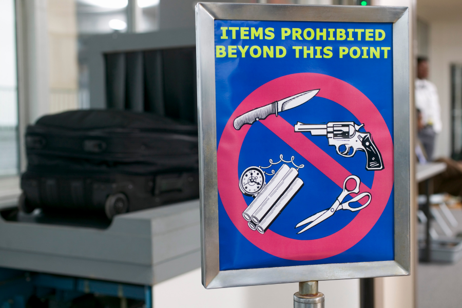 Sign shows prohibited EDC items at the airport