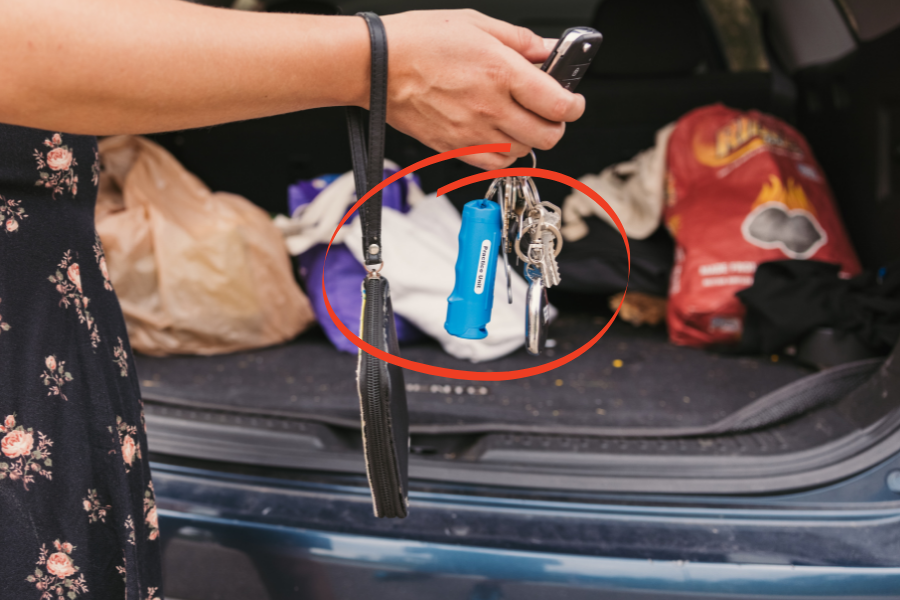 Woman carries her EDC pepper spray on a keychain.