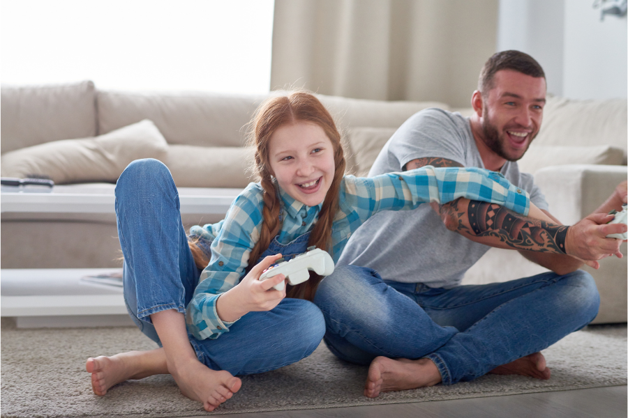 Parent and child playing video games