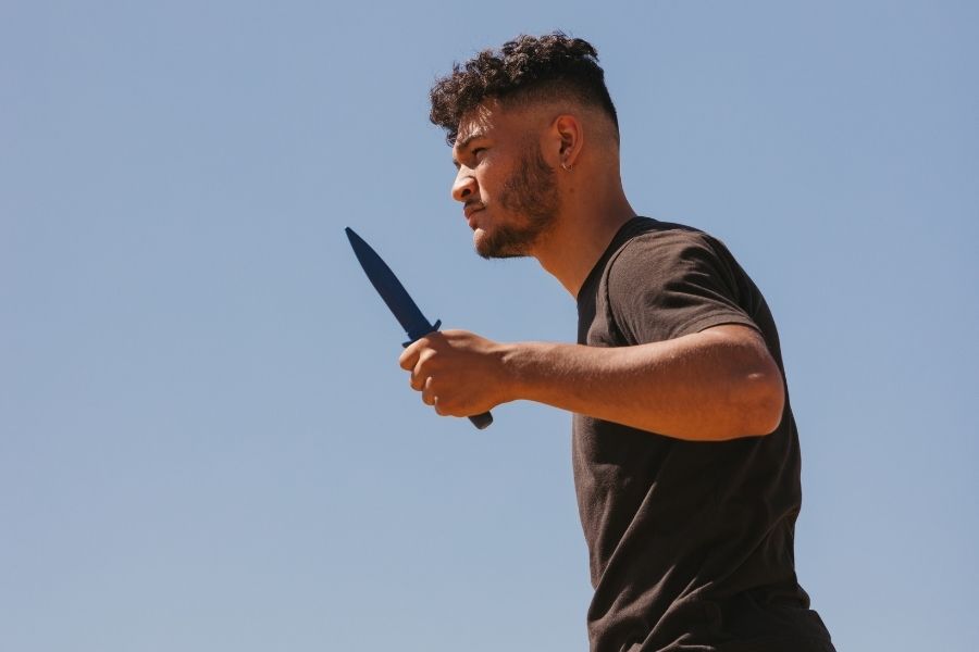 Man using a knife for self-defense