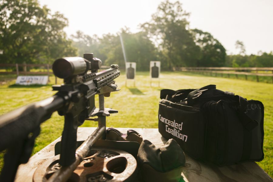 An AR-15 at an outdoor shooting range